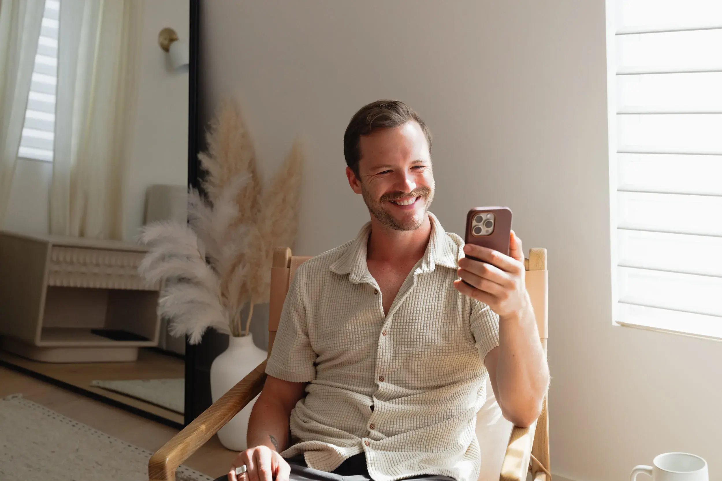 Man-smiling-at-camera